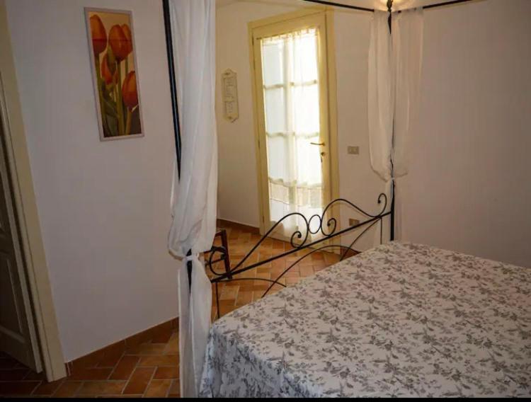 Postel nebo postele na pokoji v ubytování Agriturismo Podere Forano