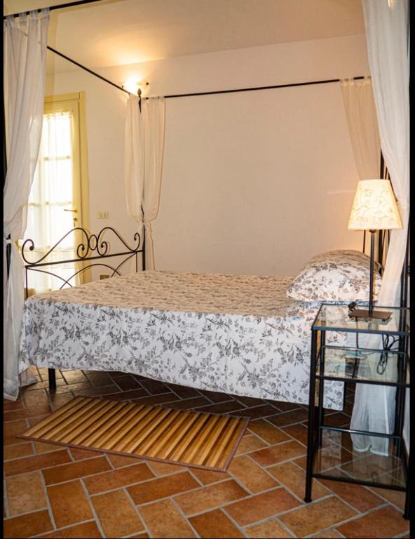 Postel nebo postele na pokoji v ubytování Agriturismo Podere Forano