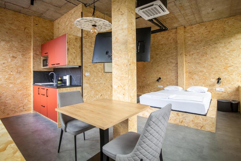 a kitchen and dining room with a table and chairs at Headline apartments in Ljubljana