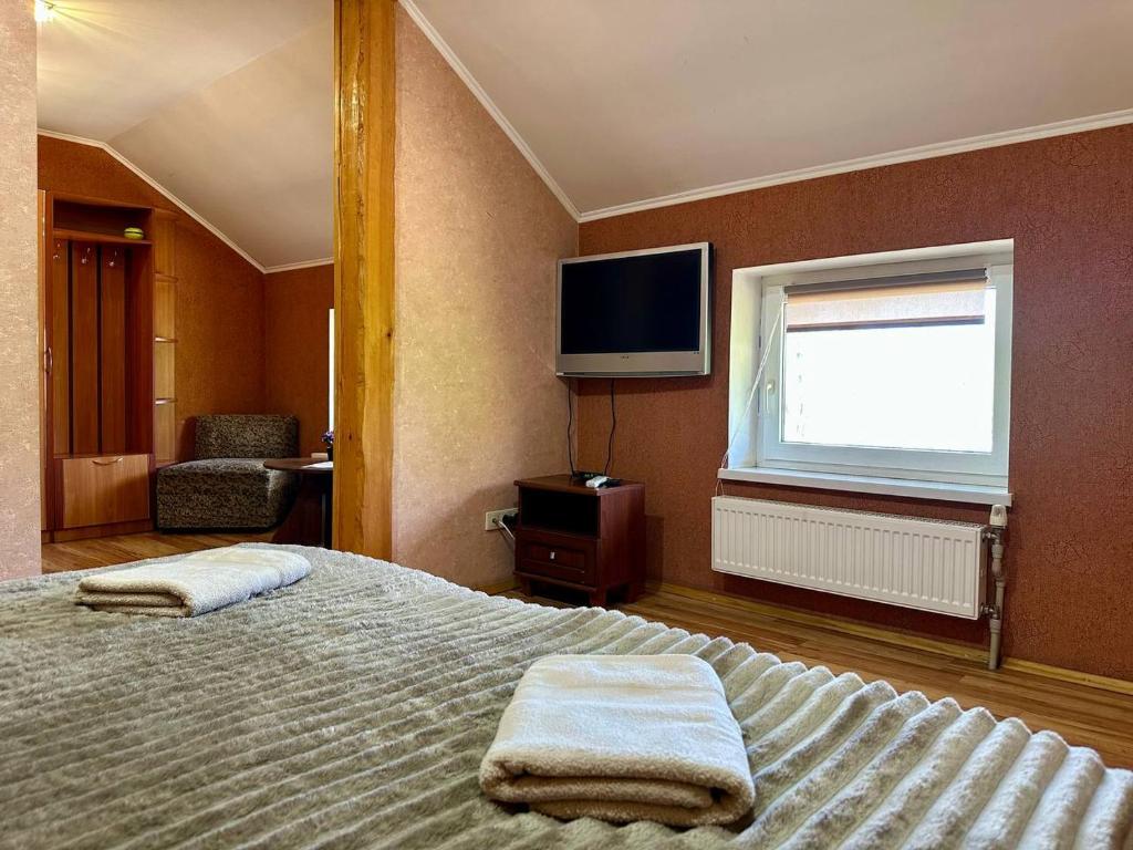 Letto o letti in una camera di JOKER Hotel