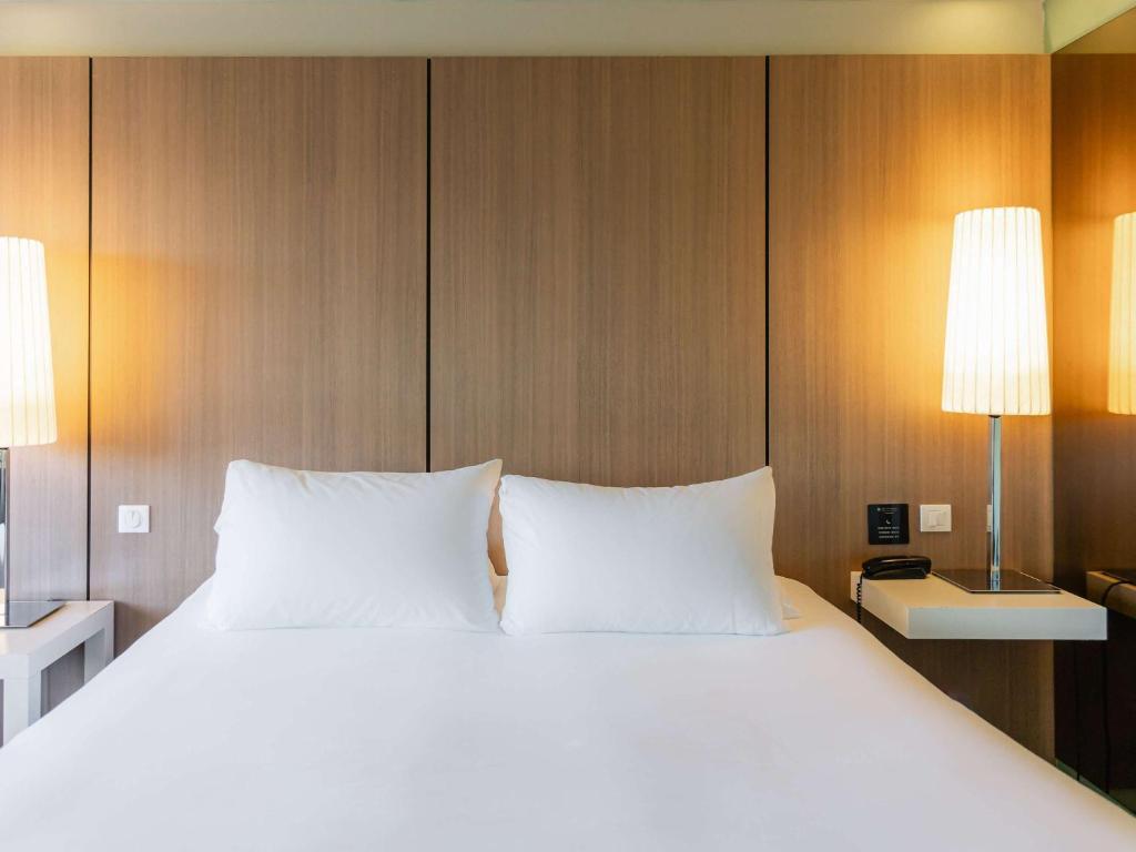 Postel nebo postele na pokoji v ubytování Pullman Bordeaux Lac