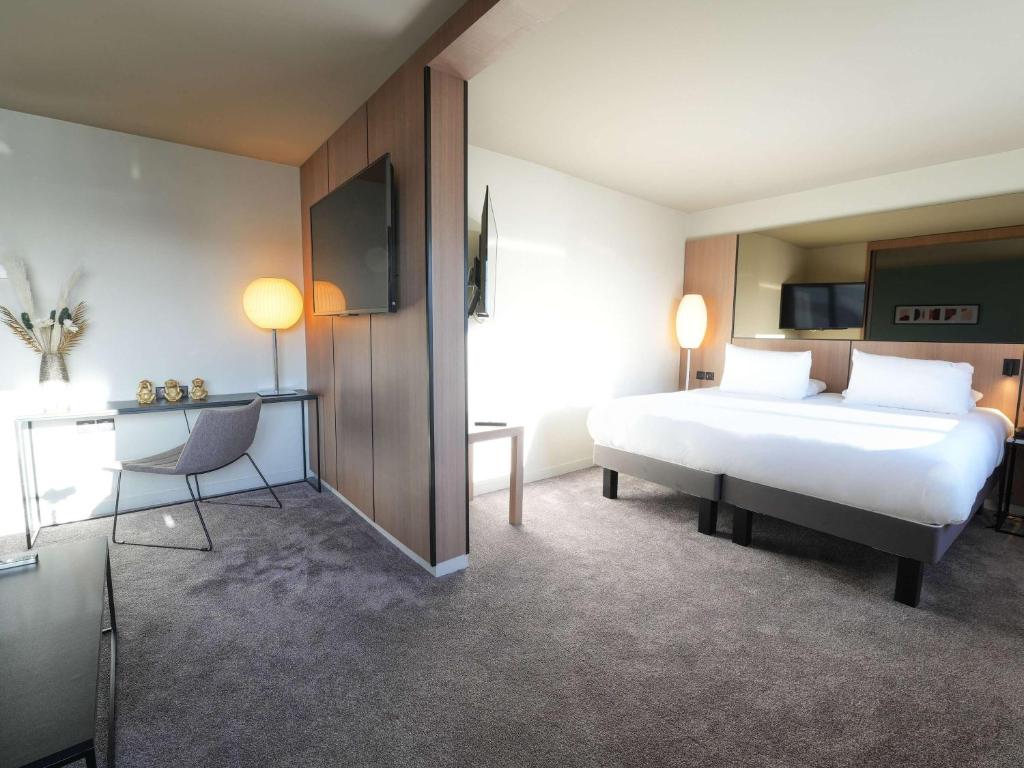 Postel nebo postele na pokoji v ubytování Pullman Bordeaux Lac