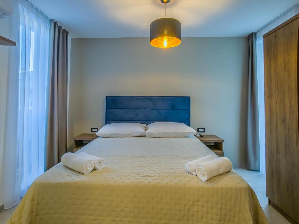 Postel nebo postele na pokoji v ubytování Sunrise Beachfront Residence
