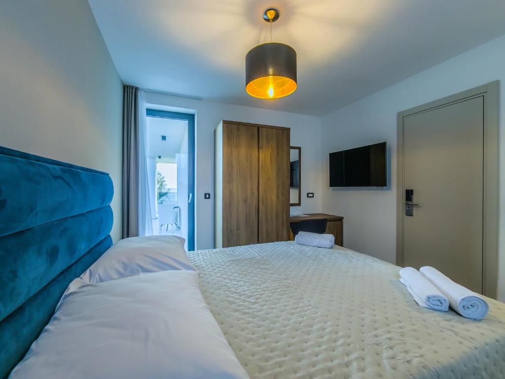 Postel nebo postele na pokoji v ubytování Sunrise Beachfront Residence