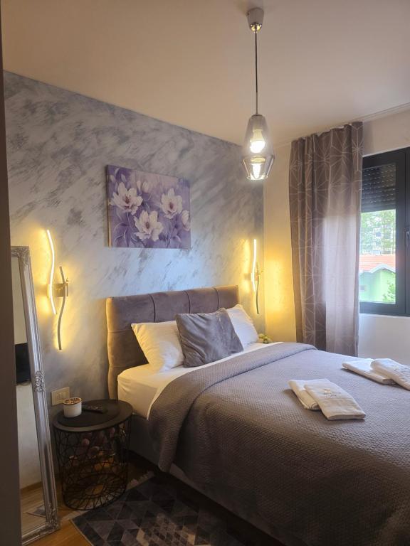 Ένα ή περισσότερα κρεβάτια σε δωμάτιο στο Apartman Ilic