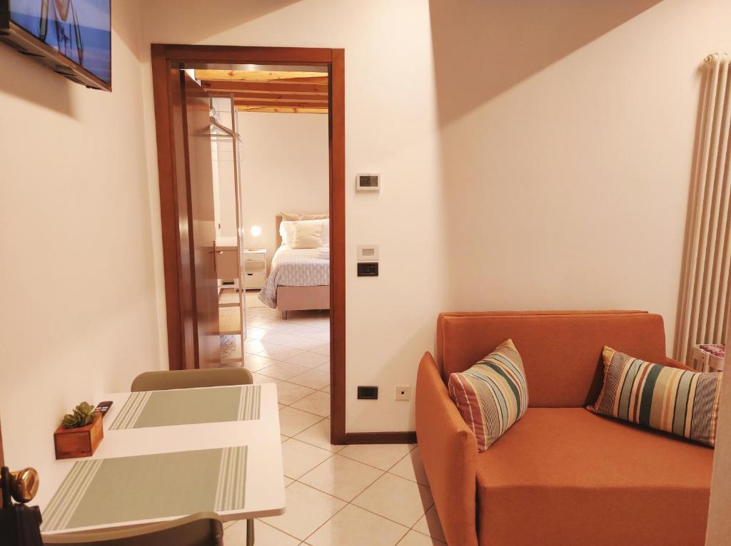a living room with a couch and a bed at CASA ALLE ERBE Prestige & Exclusive stay in Vicenza