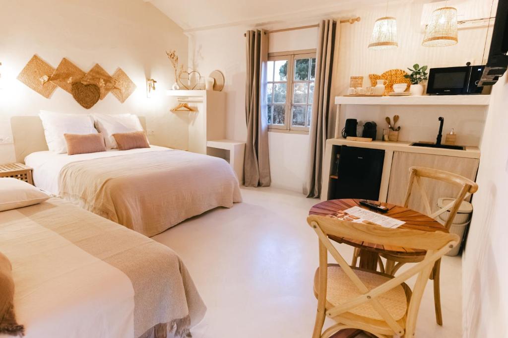 Postel nebo postele na pokoji v ubytování Auberge TAO