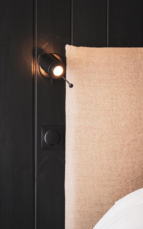 Postel nebo postele na pokoji v ubytování Doudou Hôtel