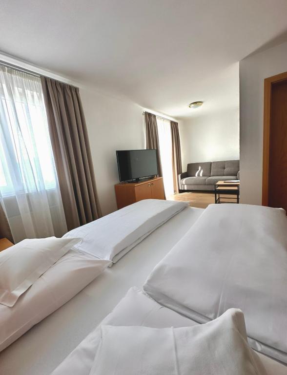 Postel nebo postele na pokoji v ubytování Garni Hotel Dorothea