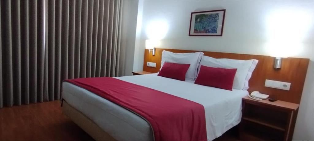 Postel nebo postele na pokoji v ubytování Hotel Dom Vilas