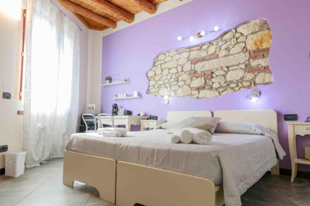 Łóżko lub łóżka w pokoju w obiekcie CQ Rooms Verona