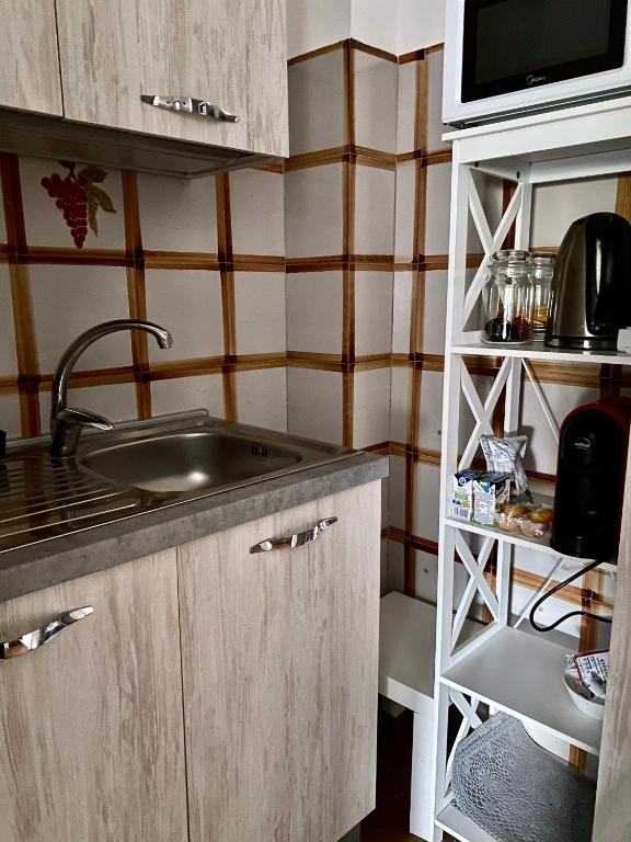 Kuchyň nebo kuchyňský kout v ubytování Casa Gaia- Castelnuovo del Garda