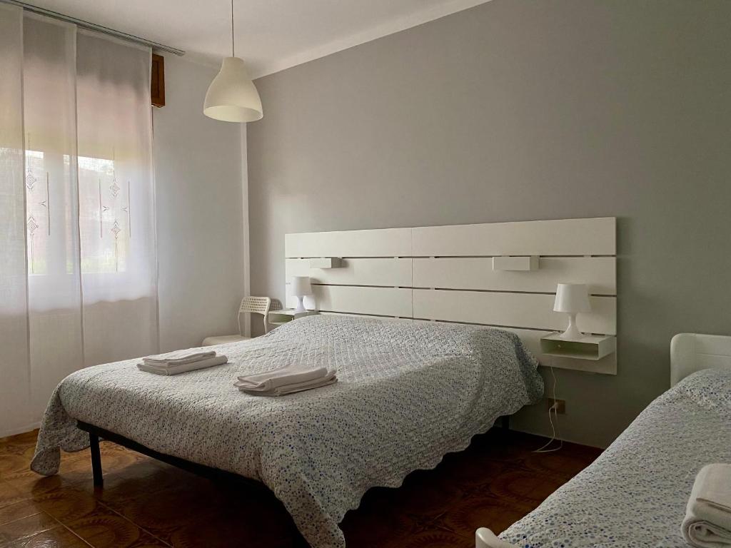 Postel nebo postele na pokoji v ubytování Casa Gaia- Castelnuovo del Garda