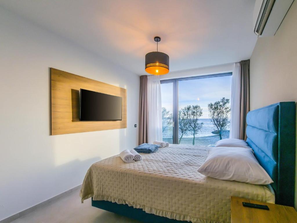 Postel nebo postele na pokoji v ubytování Sunrise Beachfront Residence