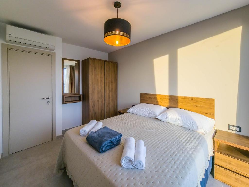 Postel nebo postele na pokoji v ubytování Sunrise Beachfront Residence
