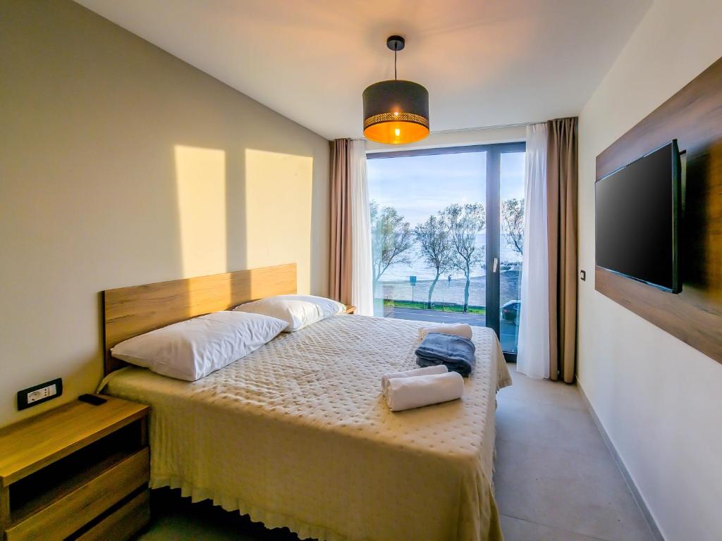 Postel nebo postele na pokoji v ubytování Sunrise Beachfront Residence