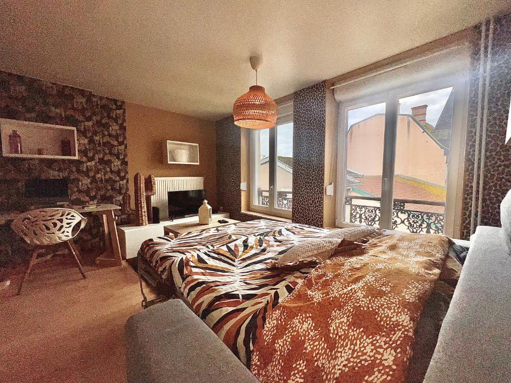 Ένα ή περισσότερα κρεβάτια σε δωμάτιο στο Studio Chic au Coeur de Verdun