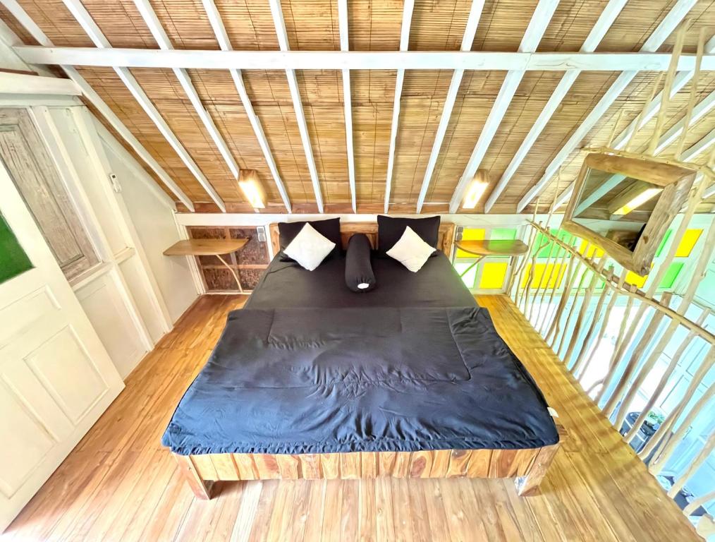 Postel nebo postele na pokoji v ubytování Pondok Is Oke Villa Scenic View