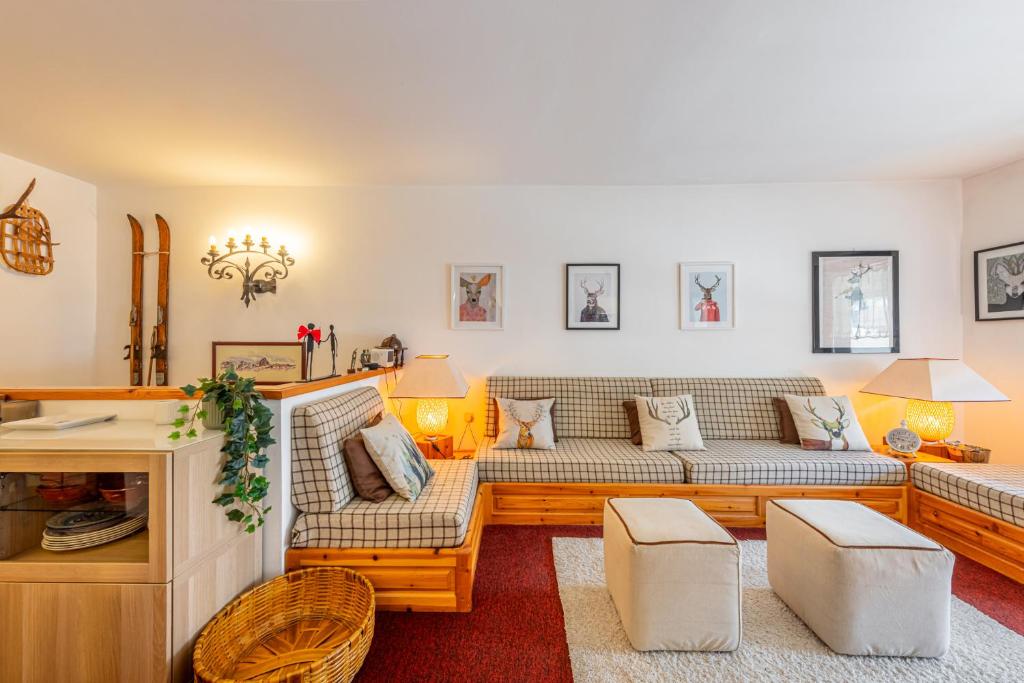 a living room with a couch and a table at Cervinia ski escape with Plateau Rosa view and garage in Breuil-Cervinia