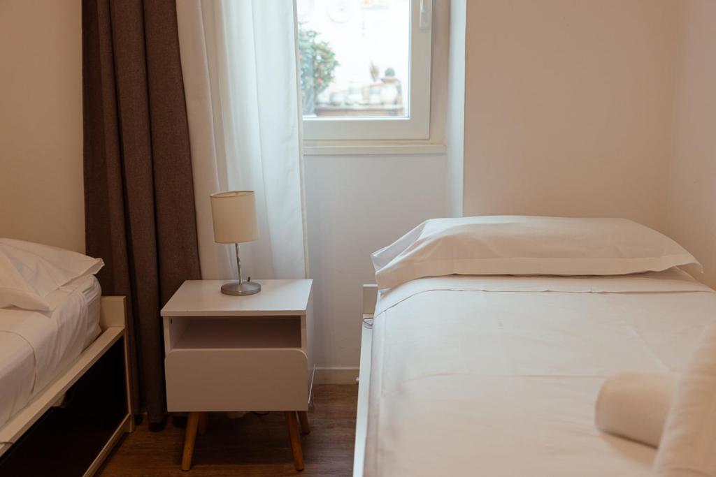 Posteľ alebo postele v izbe v ubytovaní Terrazza Vallisa