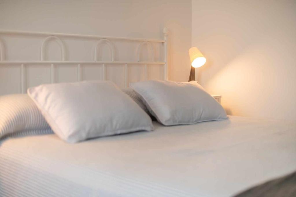 Postel nebo postele na pokoji v ubytování Apartamentos La Corrada de Andrín
