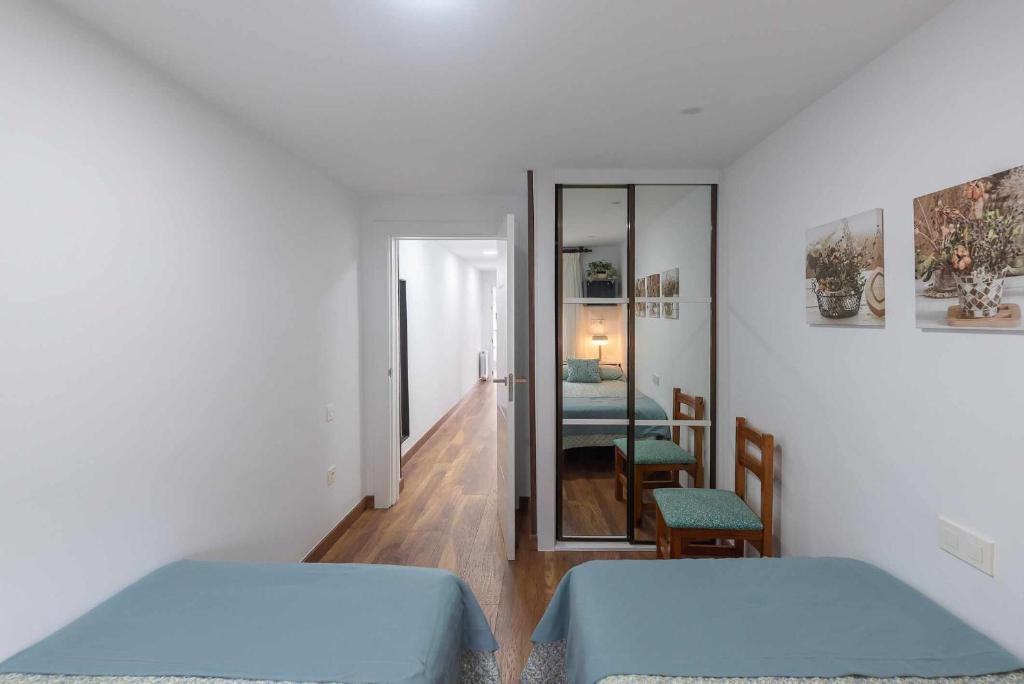 Postel nebo postele na pokoji v ubytování Apartamentos La Corrada de Andrín