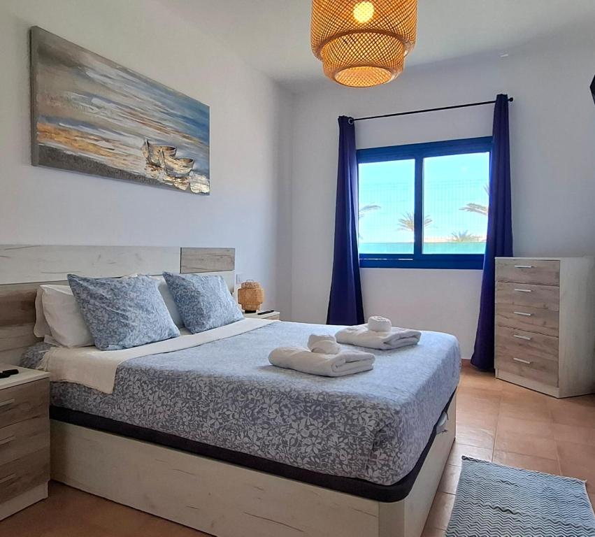 Postel nebo postele na pokoji v ubytování Casa Sol y Mar