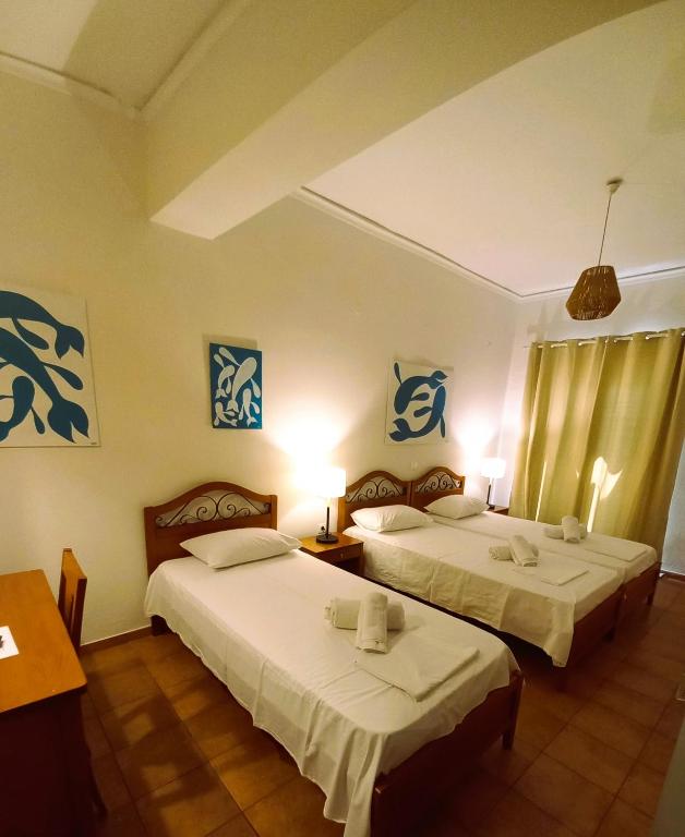 Postel nebo postele na pokoji v ubytování A Hotel Faros