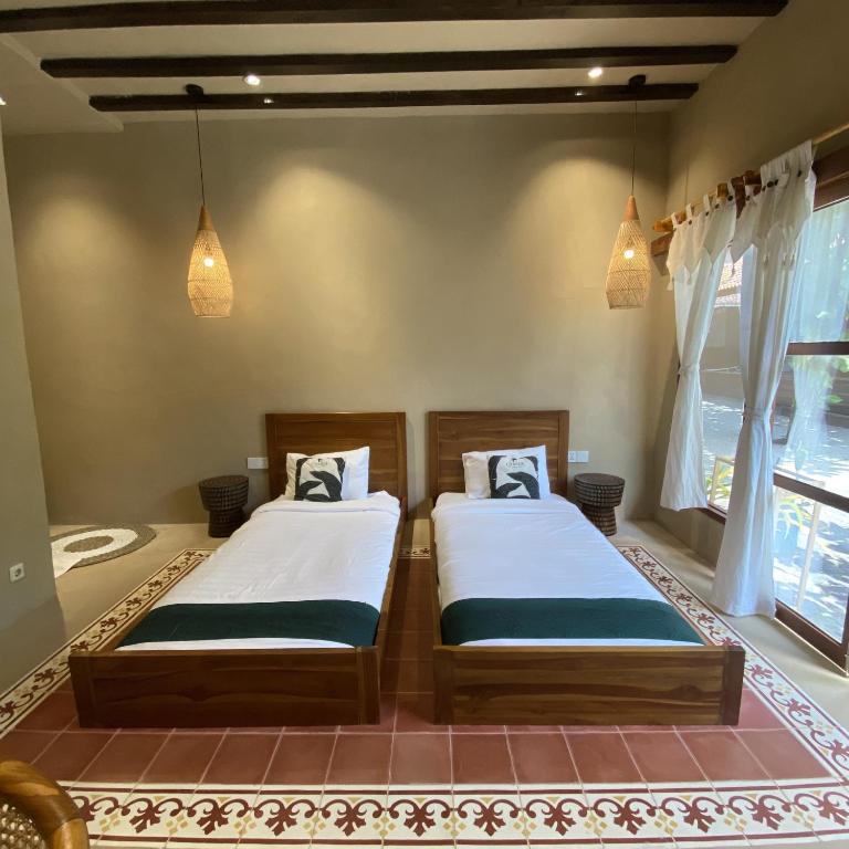 Postel nebo postele na pokoji v ubytování Cabana Surf and Stay