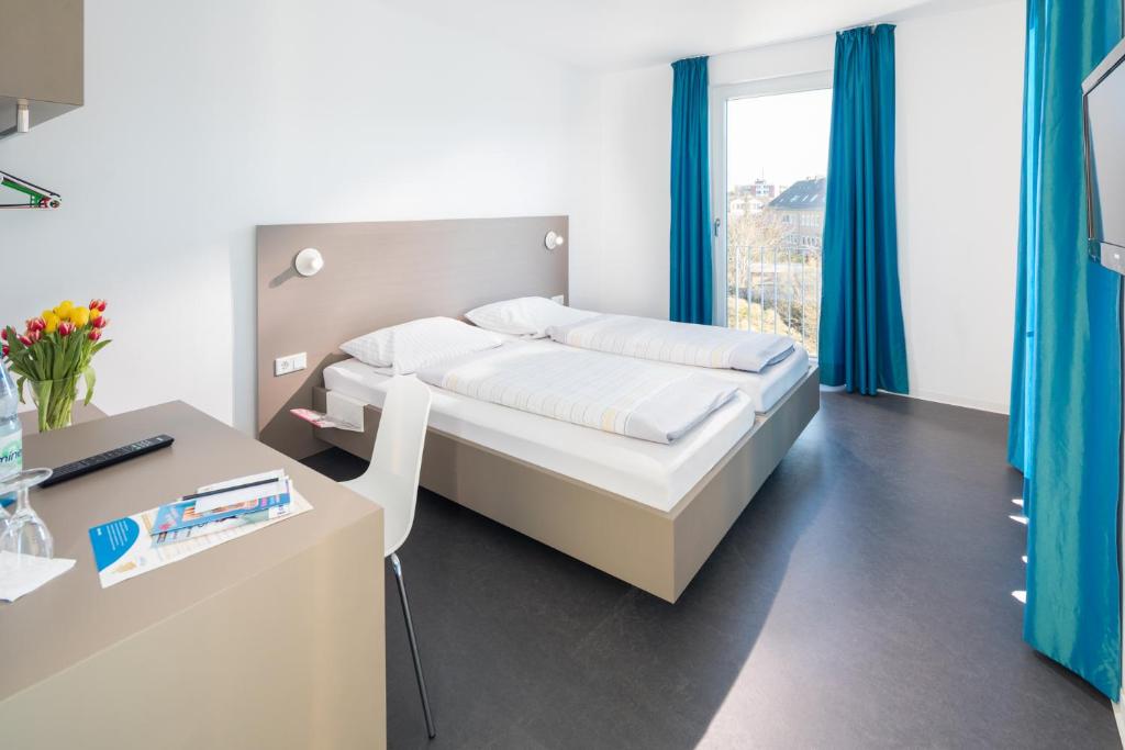 Postel nebo postele na pokoji v ubytování Jugendhaus Klipper Norderney