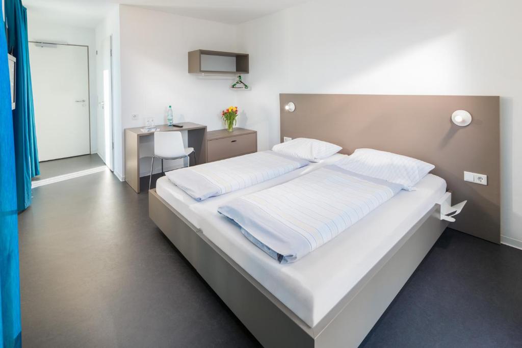 Postel nebo postele na pokoji v ubytování Jugendhaus Klipper Norderney