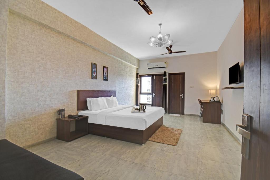 Postel nebo postele na pokoji v ubytování Townhouse Classio Suites