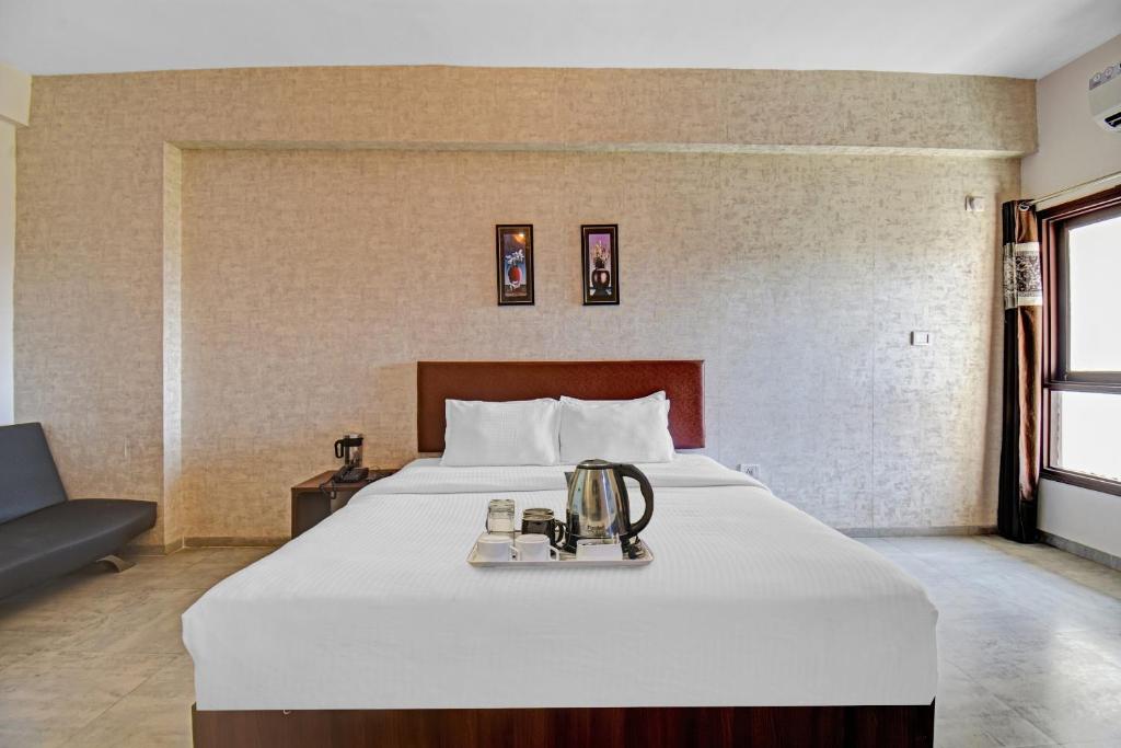 Postel nebo postele na pokoji v ubytování Townhouse Classio Suites