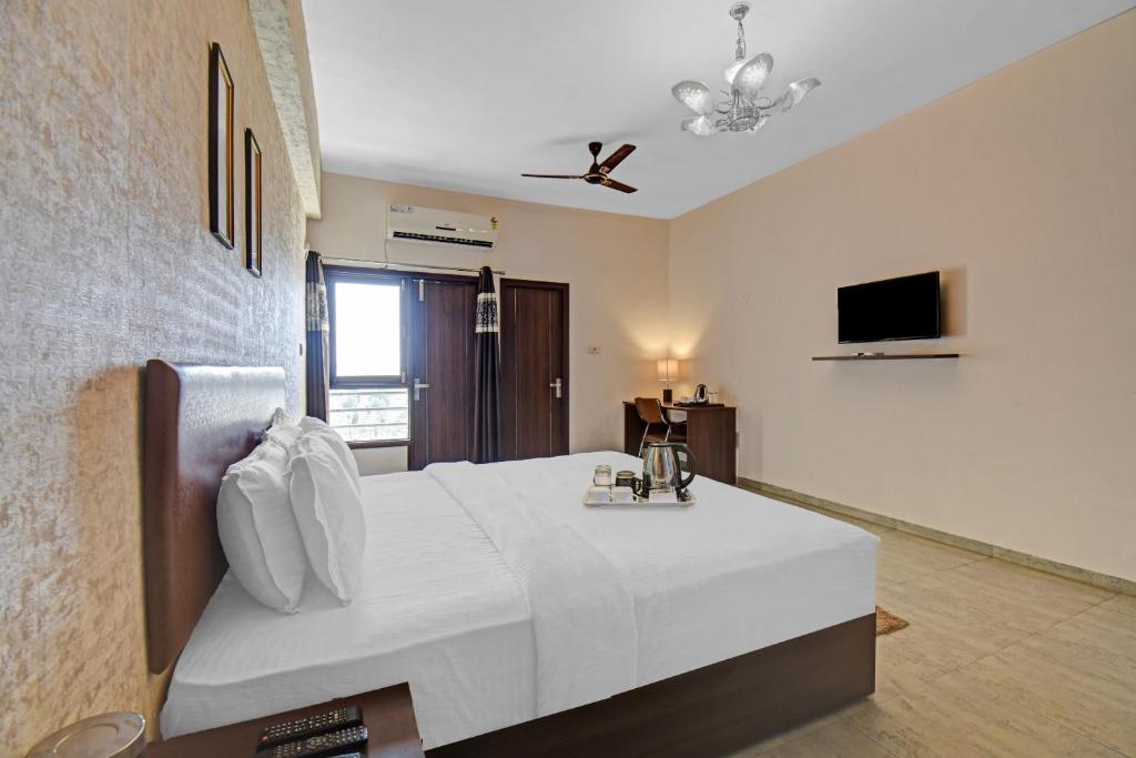 Postel nebo postele na pokoji v ubytování Townhouse Classio Suites