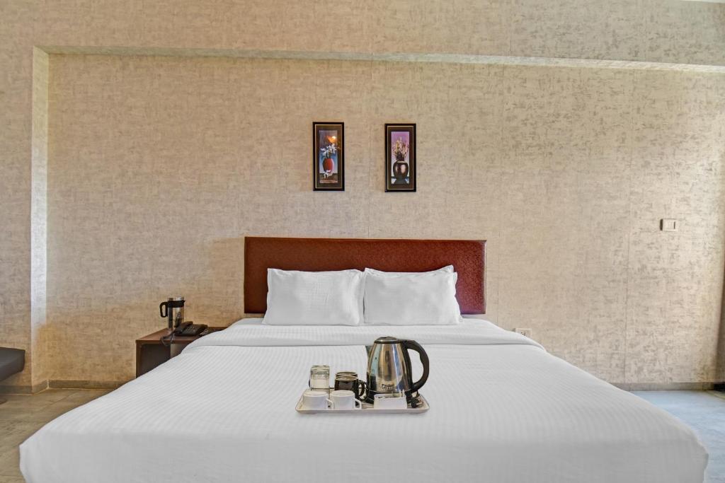 Postel nebo postele na pokoji v ubytování Townhouse Classio Suites