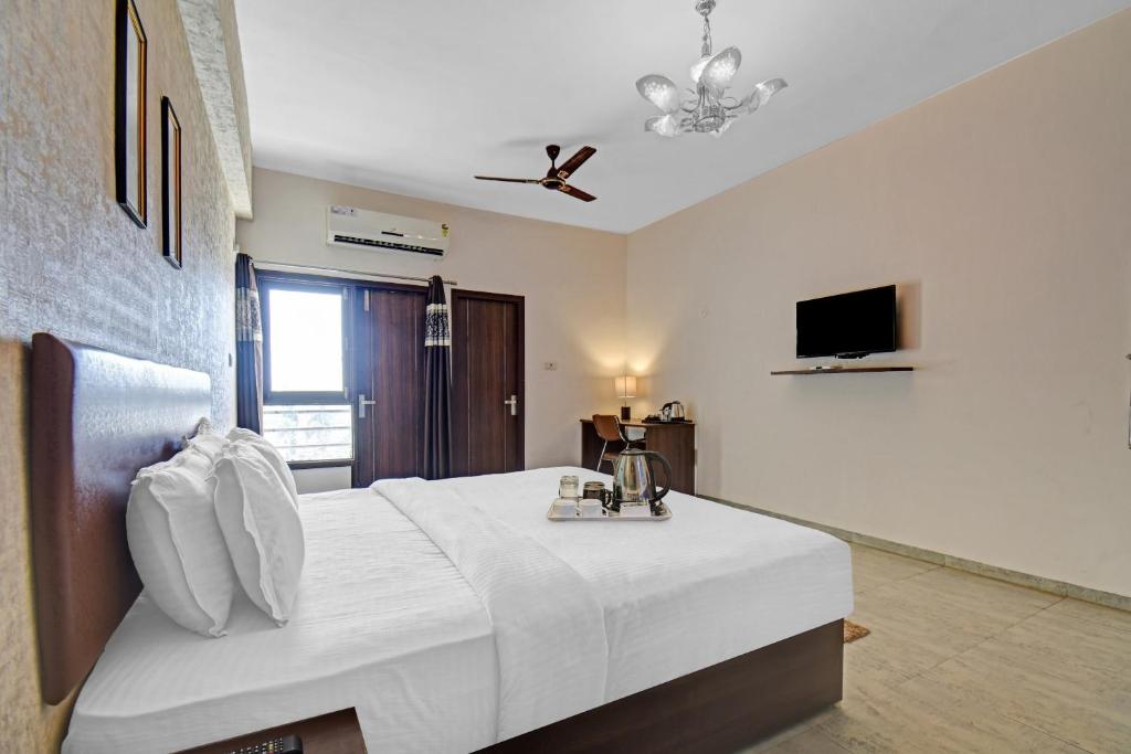 Postel nebo postele na pokoji v ubytování Townhouse Classio Suites
