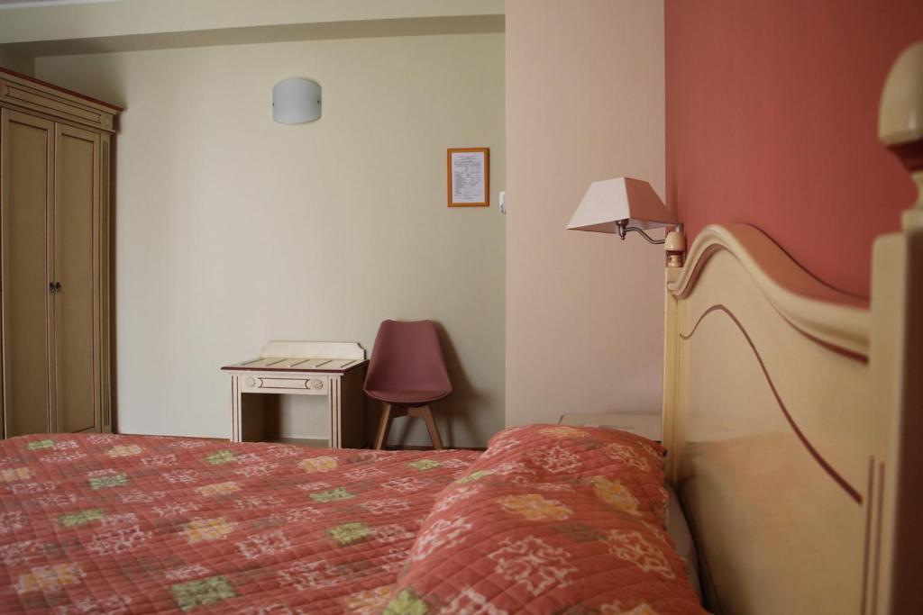 Postel nebo postele na pokoji v ubytování Hotel Matteotti