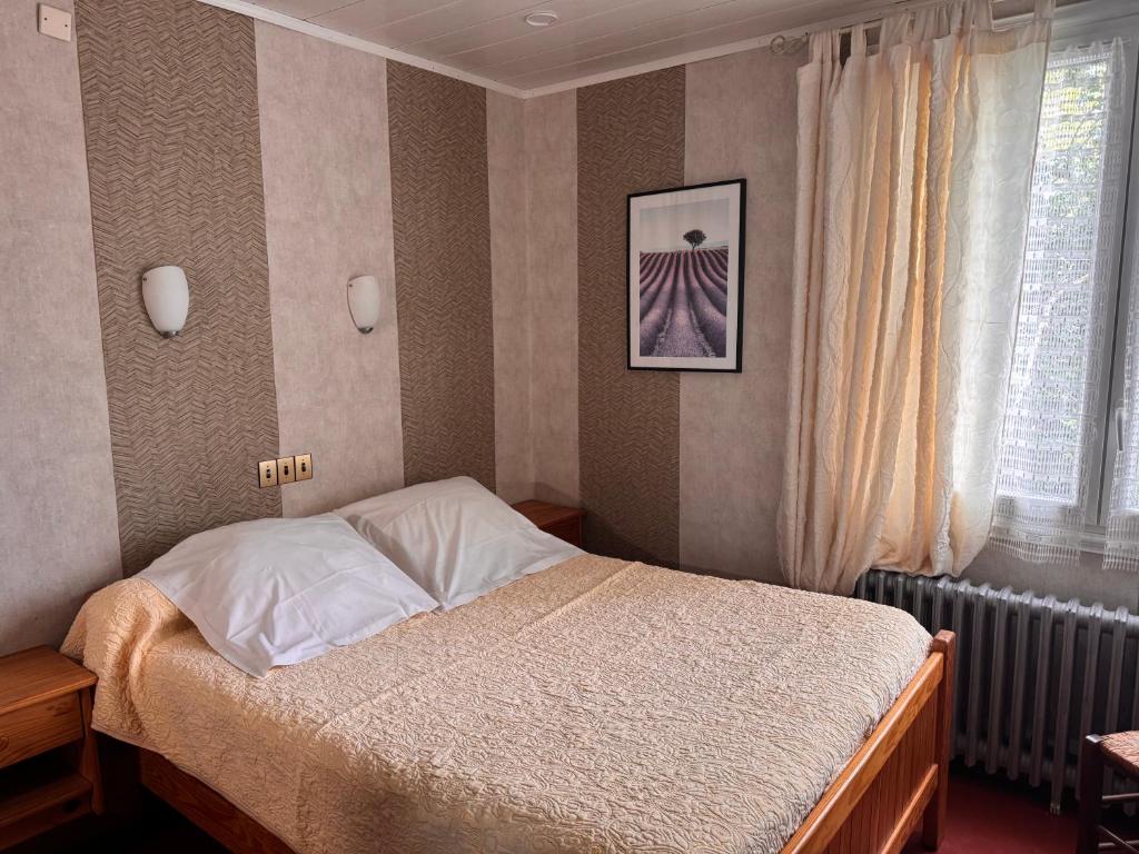 Postel nebo postele na pokoji v ubytování Le Chemin Neuf