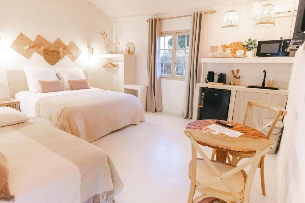 Postel nebo postele na pokoji v ubytování Auberge TAO