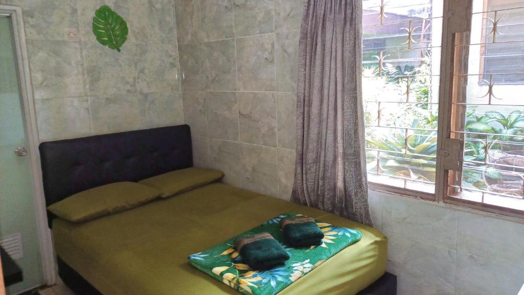 Voodi või voodid majutusasutuse GIO Guesthouse Bogor toas