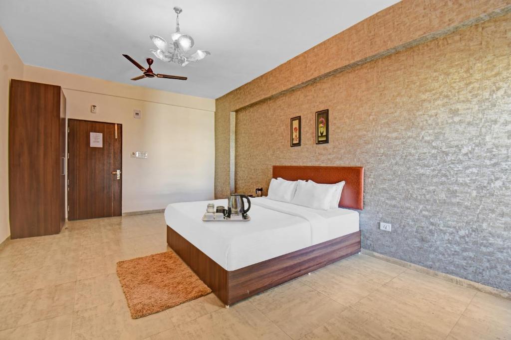 Postel nebo postele na pokoji v ubytování Townhouse Classio Suites