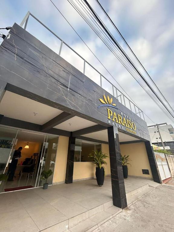 a building with a sign on the front of it at Hotel Paraiso Natal - EXPRESS in Natal