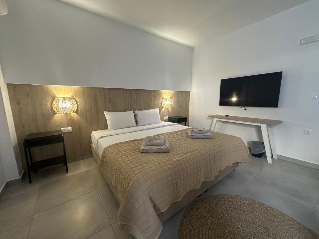 Postel nebo postele na pokoji v ubytování Anfi Suites