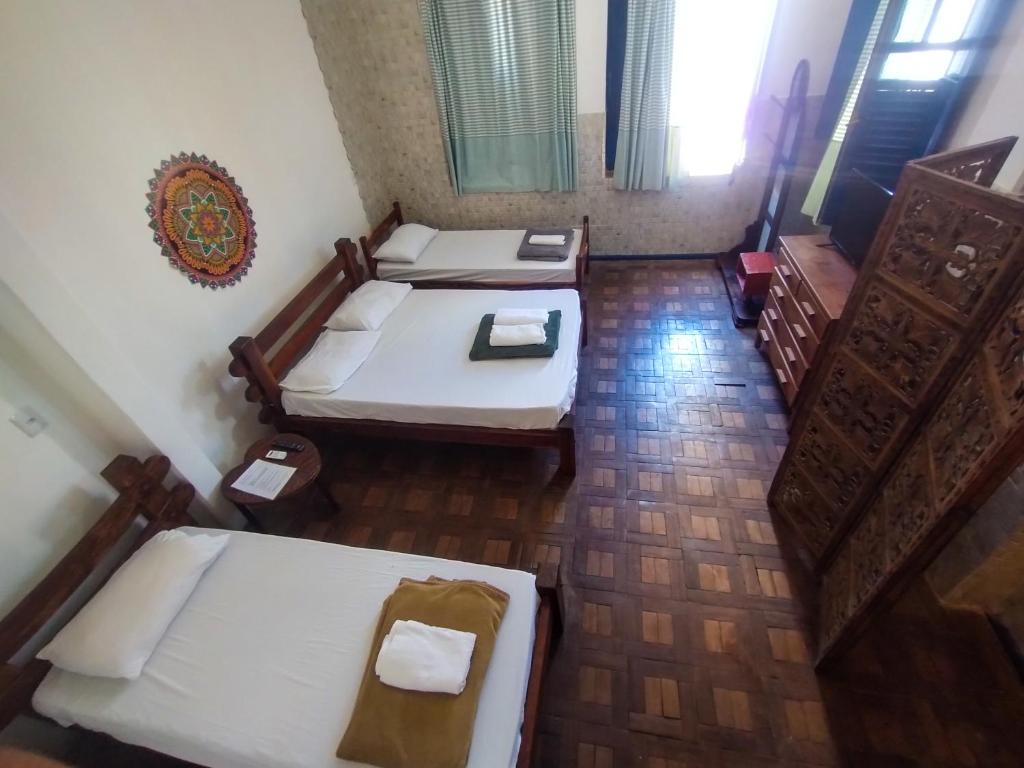 Postel nebo postele na pokoji v ubytování Pousada e Hostel Andarai