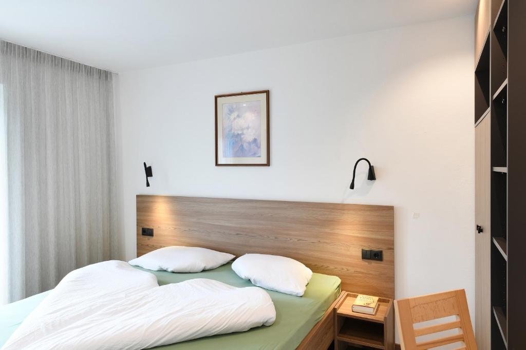 Posteľ alebo postele v izbe v ubytovaní Haus Rosengarten