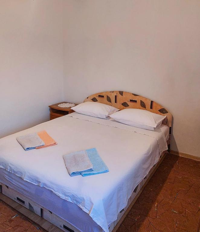 Postel nebo postele na pokoji v ubytování Apartmani Branko