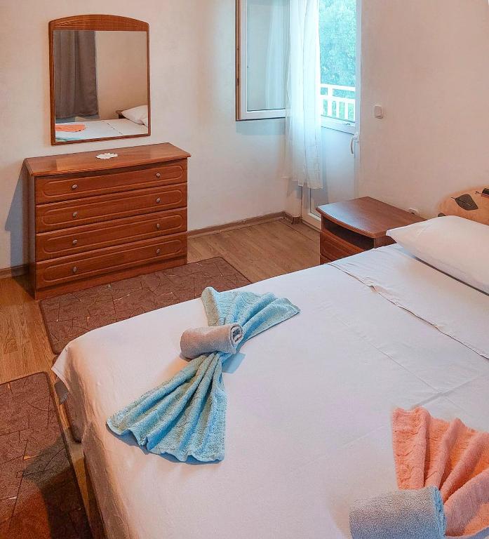 Postel nebo postele na pokoji v ubytování Apartmani Branko