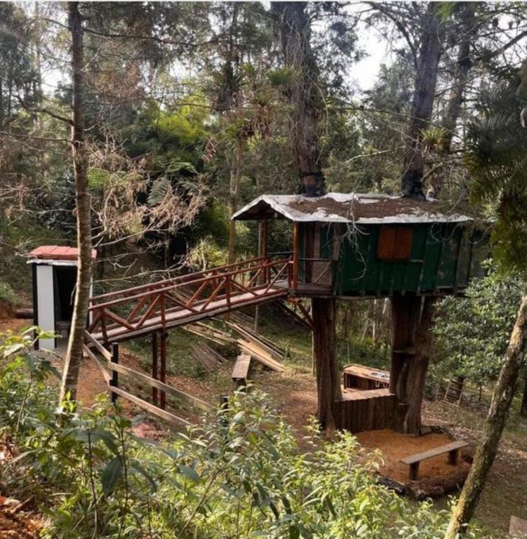 a tree house in the middle of a forest at Refugio en el Árbol in Guarne