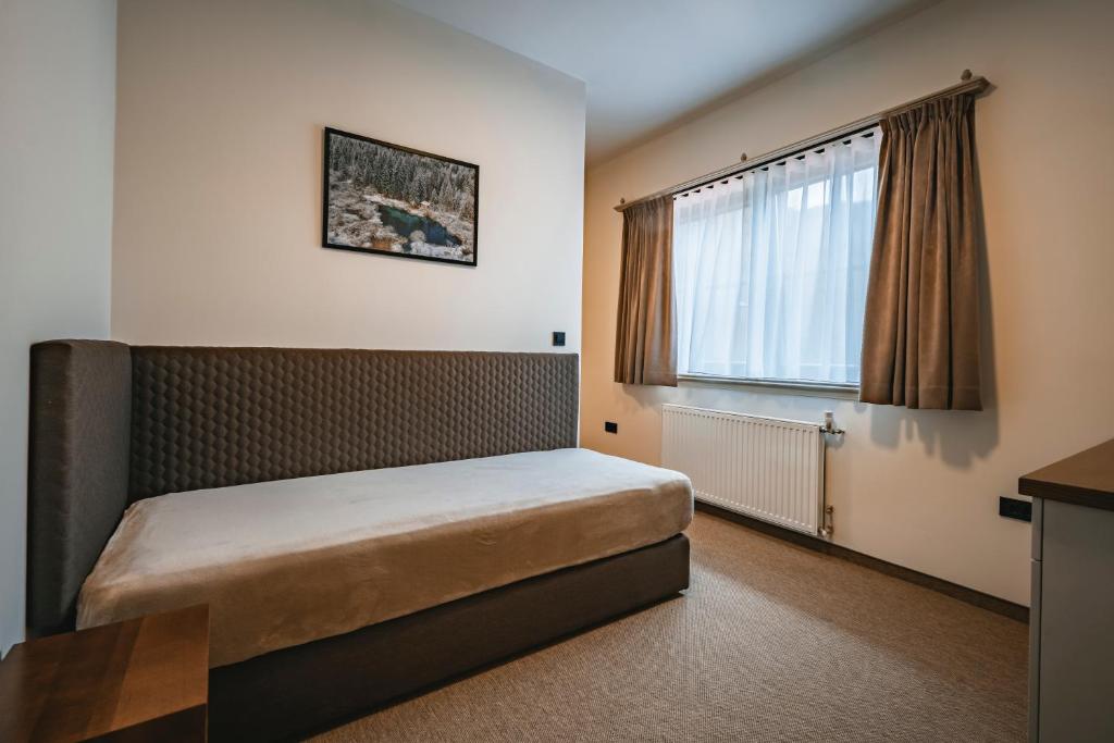 Postel nebo postele na pokoji v ubytování Guest House EJGA