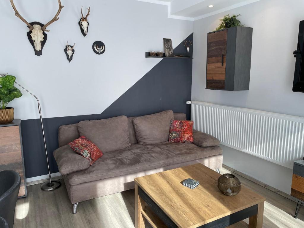 a living room with a couch and a table at Apartment Nikki in Medebach